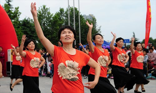 <em>Guangchangwu</em> dancers participate in a contest in the Luyang district of Hefei, Anhui Province, on September 28, to celebrate the National Day holidays. Photo: IC