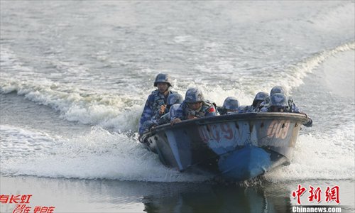 Chinese marines soldiers attend an exercise during a marines landing drill at their base in Zhanjiang, Guangdong province, December 23, 2012. The Marine Corps under the PLA Navy's South China Sea Fleet kicked off the tactical exercise of the landing drill at their base in Zhanjiang, Guangdong province. Source: Chinanews.com