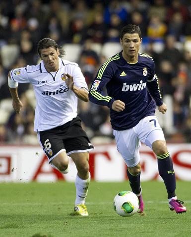 Real Madrid's Cristiano Ronaldo (right) and Valencia's Nelson Valdez in action during the Spanish King's Cup quarterfinal second leg match on Wednesday.  Photo: AFP