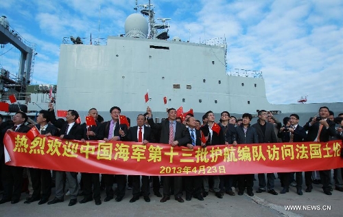 Local overseas Chinese welcome the 13th naval escort squad sent by the Chinese People's Liberation Army (PLA) Navy at the Toulon harbour in France, April 23, 2013. The 13th convoy fleet including the frigates Huangshan and Hengyang and the supply ship Qinghaihu arrive in Toulon, France on Tuesday, beginning a five-day visit to the country. (Xinhua/Gao Jing) 