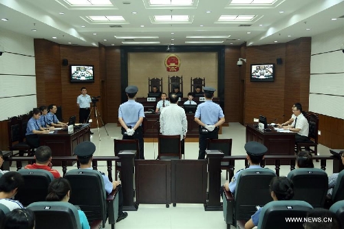 Lei Zhengfu, former secretary of Chongqing's Beibei District Committee of the Communist Party of China, waits for sentence at the Chongqing No. 1 Intermediate People's Court in southwest China's Chongqing, June 28, 2013. Lei who was embroiled in a sex video scandal was sentenced to 13 years in jail for bribery and fined 300,000 yuan (48,554 U.S. dollars).  