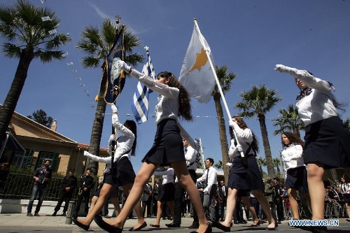 Cypriots parade in Nicosia on March 25, 2013, to mark the 192nd anniversary of Greece's Independence Day, hours after Eurozone ministers approved a new bailout plan for Cyprus. With about 80 percent of its population being Greek Cyprus, Cyprus and Greece enjoy extremely close relationship. (Xinhua/Marios Lolos) 