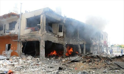 Photo taken on May 11, 2013 shows the site of an explosion in the town of Reyhanli, in the southern Turkish province of Hatay. At least 40 people were killed and 100 others injured after explosions shook a Turkish town on Saturday near the border with Syria, Turkish Interior Minister Muammer Guler said. (Xinhua/NTV)