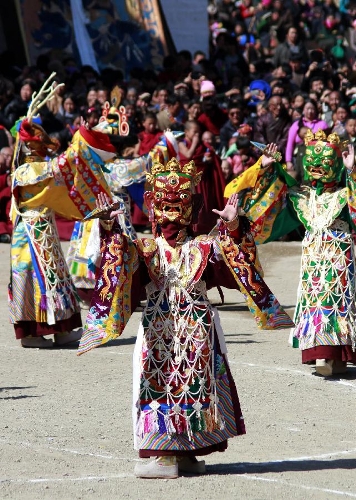 A masked Buddhist monk performs a ritual dance to pray for good fortune and harvest at the Labrang Monastery in Xiahe County, Gannan Tibetan Autonomous Prefecture, northwest China's Gansu Province, Feb. 23, 2013. The Labrang Monastery is among the six great monasteries of the Geluk school of Tibetan Buddhism. (Xinhua/Shi Youdong) 
