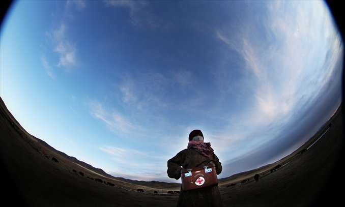 Doctor Dan Zhengcao is on her way to a villager's home in Gannan Tibetan Autonomous Prefecture, Gansu Province on January 10. The doctor, who has been working in the grasslands for 20 years, was named 