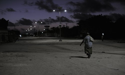 This handout photo released by the AU-UN 1ST shows a man returning home from a mosque in Mogadishu on Tuesday. AMISOM, in support of the Somali Police Force, last night cordoned off one square kilometer in Mogadishu to weed out members of the extremist group, al Shabaab. Many of young men here were temporarily detained by the SPF and then screened to determine whether they had any links to the group. Photo: AFP