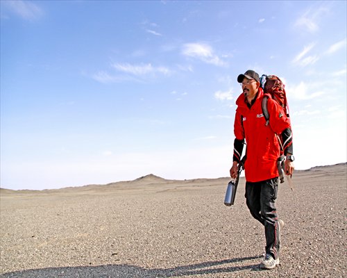 Lei Diansheng walking in Lop Nur desert, which marked the emotional and physical end of his decade-long walk around China in 2008. Photo: Courtesy of Lei Diansheng