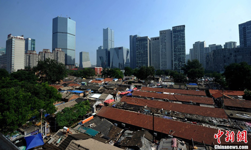 While is unknown exactly how many people live in Huashiying, official numbers estimate around 700,000 inhabitants reside in dense and tightly-knit houses like the ones in Huashiying. During an economic conference held in Beijing this July, vice mayor Chen Gang said the municipality plans to invest some 500 billion yuan ($81.65 billion) to renovate such areas over the next five years. Photo: Jin Shuo/chinanews.com 