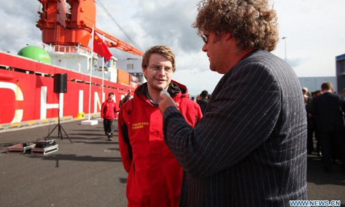 A scholar from Iceland receives interviews as China's icebreaker Xuelong, or 