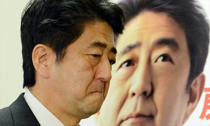 Japan's main opposition Liberal Democratic Party (LDP) leader Shinzo Abe arrives at a conference room for a press conference at the LDP headquarters in Tokyo on Monday.  Incoming Japanese prime minister Shinzo Abe came out fighting on Monday after his sweeping election victory, saying there can be no compromise on the sovereignty of islands at the center of a dispute with China. Photo: AFP