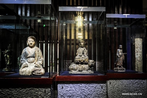 Photo taken on May 15, 2013 shows cultural relics of the Kingdom of Xia on display in an exhibiton in Changchun, capital of northeast China's Jilin Province. An exhibition of the cultural relics of the Kingdom of Xia, a regime founded in west China in 1038, was held here on Wednesday, in which more than 100 cultural relics of the kingdom excavated since the founding of the People's Republic of China in 1949 were shown to the public. (Xinhua/Xu Chang)&nbsp; 