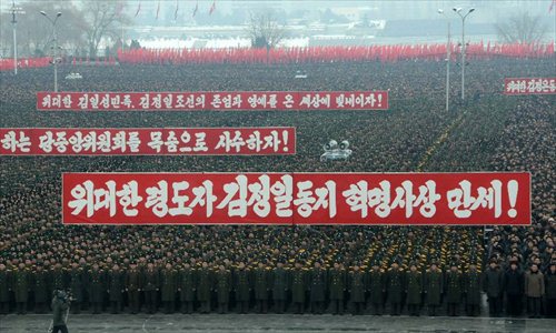 Military officers, soldiers and civilians gather to celebrate the successful launch of the Kwangmyongsong-3 satellite in Pyongyang, capital of the Democratic People's Republic of Korea (DPRK), on Dec. 14, 2012. According to the DPRK's official media KCNA, a Unha-3 rocket carrying the second version of the Kwangmyongsong-3 satellite blasted off from the Sohae Space Center in Cholsan County, North Phyongan Province, on Dec. 12. Photo: Xinhua