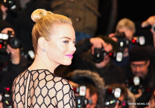 Actress Emma Stone poses on the red carpet for the screening of the film 