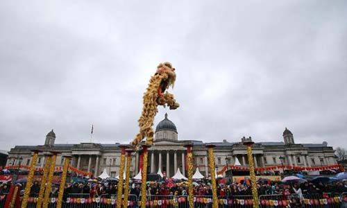 People perform lion dance during a celebration marking the Chinese Lunar New Year at Trafalgar Square in London, Britain, on Feb. 10, 2013. Photo: Xinhua