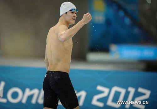 Sun Yang of China celebrates after men's 200m freestyle final of swimming at the London 2012 Olympic Games in London, Britain, July 30, 2012. Sun Yang of China and Park Taehwan of South Korea shared silver medal with 1:44.93. Photo: Xinhua