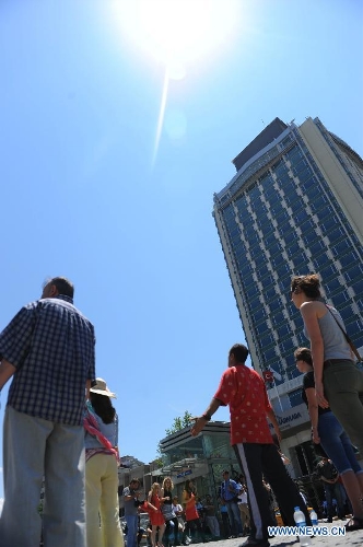 Protestors stand silently in front of Ataturk culture centre near the Taksim Square in Istanbul, Turkey, on June 18, 2013. Hundreds of people stood silently from morning to evening on Tuesday here to protest against the government. Nationwide protests began when an environmentalists' rally aiming to preserve Gezi Park adjacent to Taksim Square in Istanbul met fierce police crackdown, which triggered a wave of fiery opposition against the government's policies. (Xinhua/Lu Zhe) 
