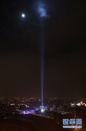 The lights of Beijing are seen at the China Millennium Monument to celebrate the New Year in Beijing, capital of China.  January 1, 2013. Photo: Xinhua