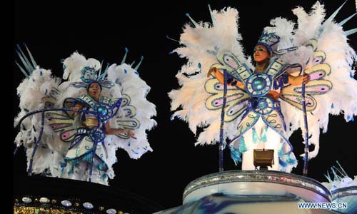 Revelers participate in the annual carnival samba parade in Rio de Janeiro, Brazil, Feb. 10, 2013. The 2013 Rio carnival samba parade began on Sunday. Photo: Xinhua