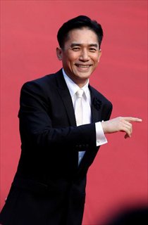 Actor Tony Leung poses for photos during the 15th Shanghai International Film Festival in Shanghai, east China, June 16, 2012.