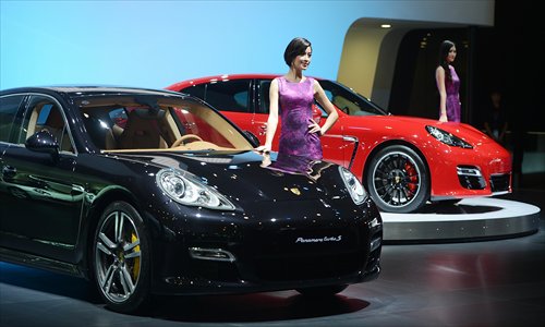 Models pose at the Chengdu Motor Show, which ended September 9. Photo: CFP