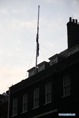 The Union Flag is shown at half mast above Downing Street following the death of former British Prime Minister Baroness Margaret Thatcher in London, Britain, on April 8, 2013. It has been confirmed that Lady Thatcher died this morning following a stroke at the age of 87. (Xinhua/Wang Lili) 
