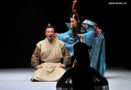 Actors Yan Rui and Wang Ban (L) from Beijing People's Art Theater play drama 
