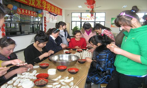 Students from Xinjiang can enjoy their hometown staple naan bread and learn to make jiaozi (dumpling) in Shanghai. Photo: Courtesy of Shanghai Qunyi Vocational and Technical School