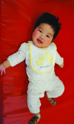 Zhen Xinuo
Born: November 22, 2012
Nationality: Chinese
This little lassie lives a happy life of sleeping, giggling, drinking breast milk and chewing her hands.
Photo: Courtesy of Amcare