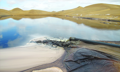 Unprocessed sewage from chemical plants in the Tenggeli industrial park, Inner Mongolia, is directly discharged into the desert in September 2012. Photo: Shao Wenjie