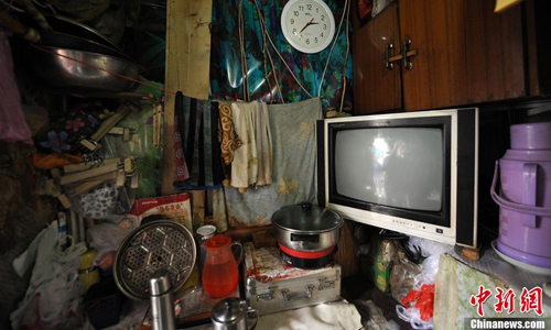Most residents live with all their possessions packed into a room no larger than five square meters. Photo: Jin Shuo/chinanews.com 