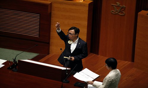 Hong Kong Legislative Council member Wong Yuk-man is sworn in at an oath-taking ceremony during a Legislative Council meeting in Hong Kong on October 10, 2012. Photo: IC