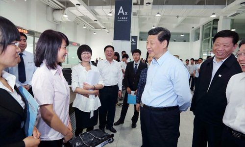 Chinese President Xi Jinping (C, front), talks with job seekers at the China HR Development & Promotion Center (Tianjin) in north China's Tianjin Municipality. Xi Jinping made an inspection tour to Tianjin from May 14 to 15. Photo: Xinhua