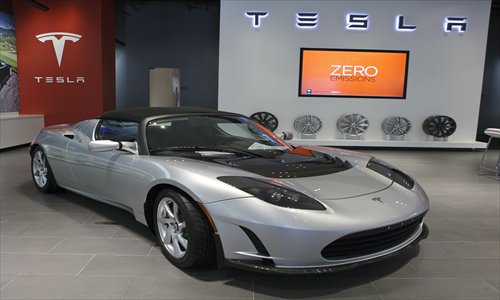 A Tesla Roadster electric sports car is displayed at a showroom in California. Photo: IC