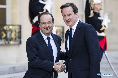 French President Francois Hollande (L) meets with British Prime Minister David Cameron at the Elysee Palace in Paris, France, May 22, 2013. French President Francois Hollande and British Prime Minister David Cameron on Wednesday condemned the assassination of a British soldier in the suburbs of London after their meeting in Paris. (Xinhua/Etienne Laurent)