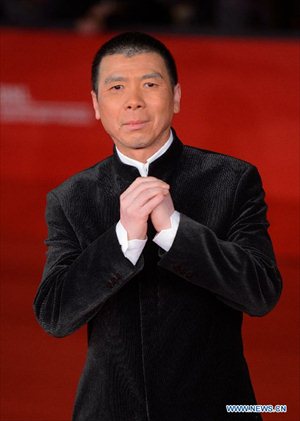 Chinese director Feng Xiaogang poses on the red carpet of the 7th Rome Film Festival in Rome, Italy, Nov. 9, 2012. The 7th Rome Film Festival opened late Friday. Feng's 