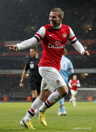 Lukas Podolski of Arsenal celebrates scoring during the English Premier League football match between Arsenal and West Ham United at the Emirates Stadium in London, Britain, on Jan. 23, 2013. Arsenal won 5-1.(Xinhua/Wang Lili)&nbsp; 