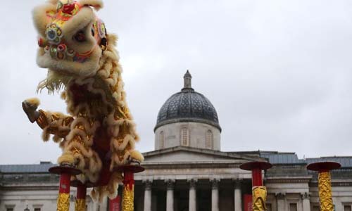 People perform lion dance during a celebration marking the Chinese Lunar New Year at Trafalgar Square in London, Britain, on Feb. 10, 2013. Photo: Xinhua