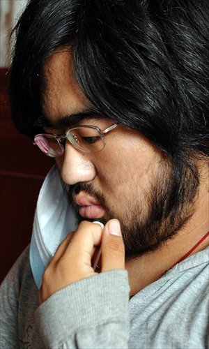 Nana, 16, is photographed at her home in Qianrenan village in Jinhua, Zhejiang Province, on October 11. Nana was diagnosed with aplastic anemia earlier this year. Her parents have spent 300,000 yuan ($47,800) on her medical treatment, but the side effects of the medicine have led to beard and body hair growth for the young woman. Though the family have spent their savings to fund her treatment, her health has not improved. She is continuing the drugs and enduring the side effects. Photo: IC