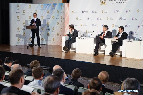 Russian Prime Minister Dmitry Medvedev (1st L, back) addresses the Gaidar forum in Moscow, Russia, Jan. 16, 2013. Participation in the BRICS was the most promising route for Russia's integration into the global economy, Prime Minister Dmitry Medvedev said Wednesday at the ongoing Gaidar forum. (Xinhua/Jiang Kehong)