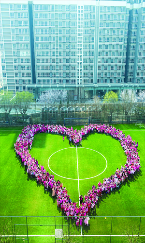 Students gather on the field of the Canadian International School on April 2 dressed in pink to commemorate Pink Shirt Day. Pink is the international anti-bullying color. Photo: Li Hao/GT