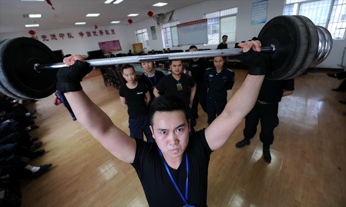 A convoy guard works out at a gym on April 19. Photo: CFP