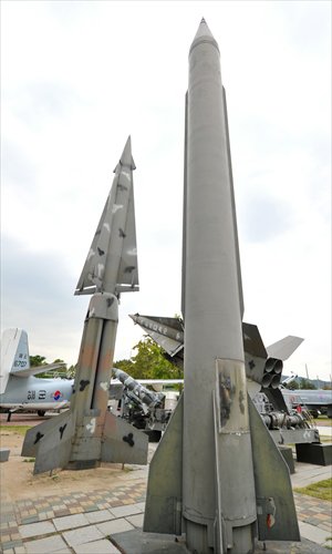 A South Korean Nike missile (left) and a replica of a North Korean Scud-B missile are displayed at the War Museum in Seoul on Monday. Photo: AFP    