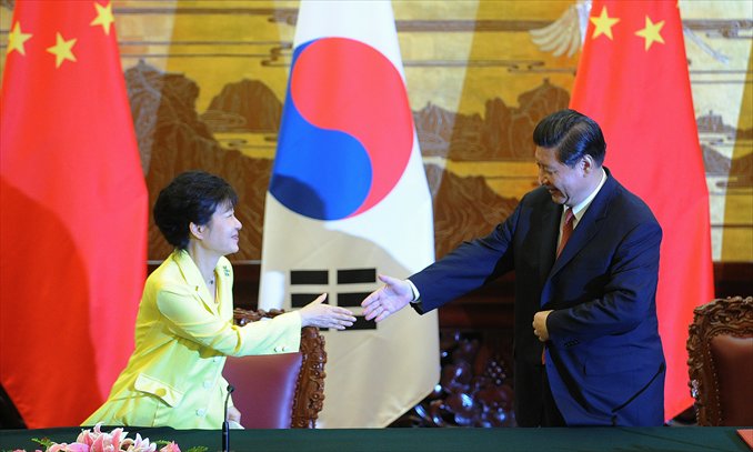 Chinese President Xi Jinping shakes hands with South Korean President Park Geun-hye (left) after a joint declaration ceremony at the Great Hall of the People in Beijing on Thursday. Park is on a visit to China from Thursday to Sunday. Photo: AFP