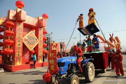 Performers take part in a Shehuo parade in Longxian County, northwest China's Shanxi Province, Feb. 22, 2013. The performance of Shehuo can be traced back to ancient rituals to worship the earth, which they believe could bring good harvests and fortunes in return. Most Shehuo performances take place around traditional Chinese festivals, especially the Spring Festival and the Lantern Festival. (Xinhua/Li Yibo)   