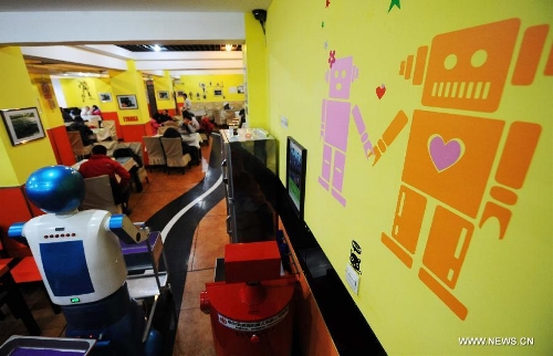 Photo taken on Jan. 18, 2013 shows the robot pictures in a robot themed restaurant in Harbin, capital of northeast China's Heilongjiang Province. Opened in June of 2012, the restaurant has gained fame by using a total of 20 robots to cook meals, deliver dishes and greet customers. (Xinhua/Wang Jianwei) 