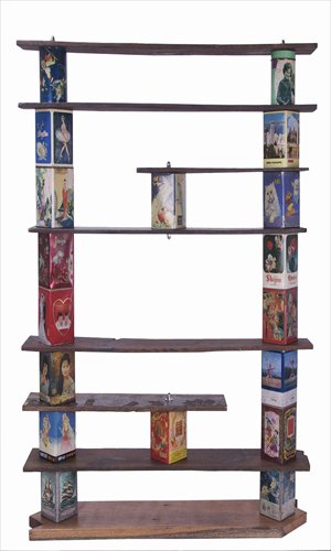 A bookshelf made from recycled house wood and old-fashioned biscuit tins Photo: Courtesy of Jonas Merian