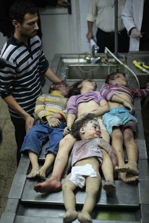 Bodies of four Palestinians children are seen at a morgue of El-Shifaa hospital in Gaza City on Nov.18, 2012. An Israeli bomb fell upon Al-Dalou family's two-storey house in Gaza City's residential al-Nasser neighborhood on Sunday, killing 11, including four children and a woman as old as 81, and reducing the structure to bubbles. It was one of the deadliest event in five days of conflict between Israel and Gazan militants. Photo: Xinhua