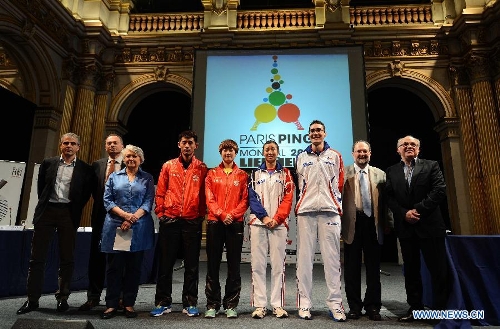 Chinese player Zhang Jike (4th, L), Ding Ning (C), President of the International Table Tennis Federation (ITTF) Adham Sharara (2nd, R) pose for photos during the official draw of the upcoming World Table Tennis Championships in Paris, France, May 11, 2013. The world championships will kick off on May 13 and the final event will be held on May 20. (Xinhua/Tao Xiyi) 