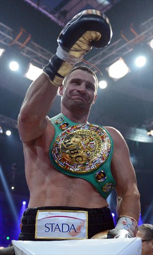 Inset top: Vitali Klitschko celebrates winning the WBC heavyweight title fight over Manuel Charr on September 8. 