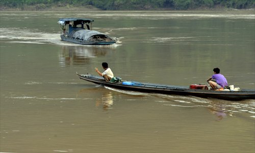 Chinese fishermen sailing on the Mekong River near Guanlei port, Yunnan Province on September 5, 2012. After the murders occurred on October 5, 2011, cargo transportation and tourism were temporarily suspended. Photo: CFP